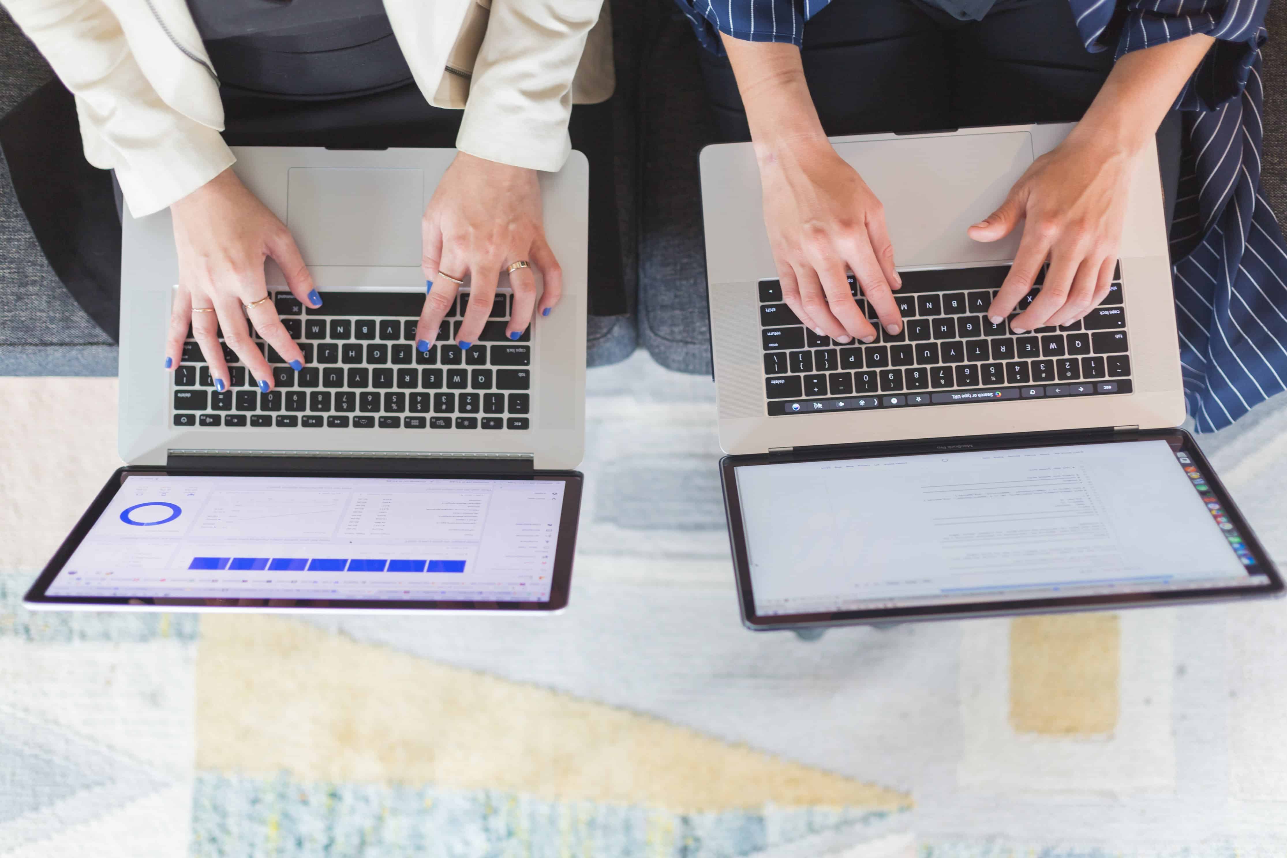 hands on laptop keyboard