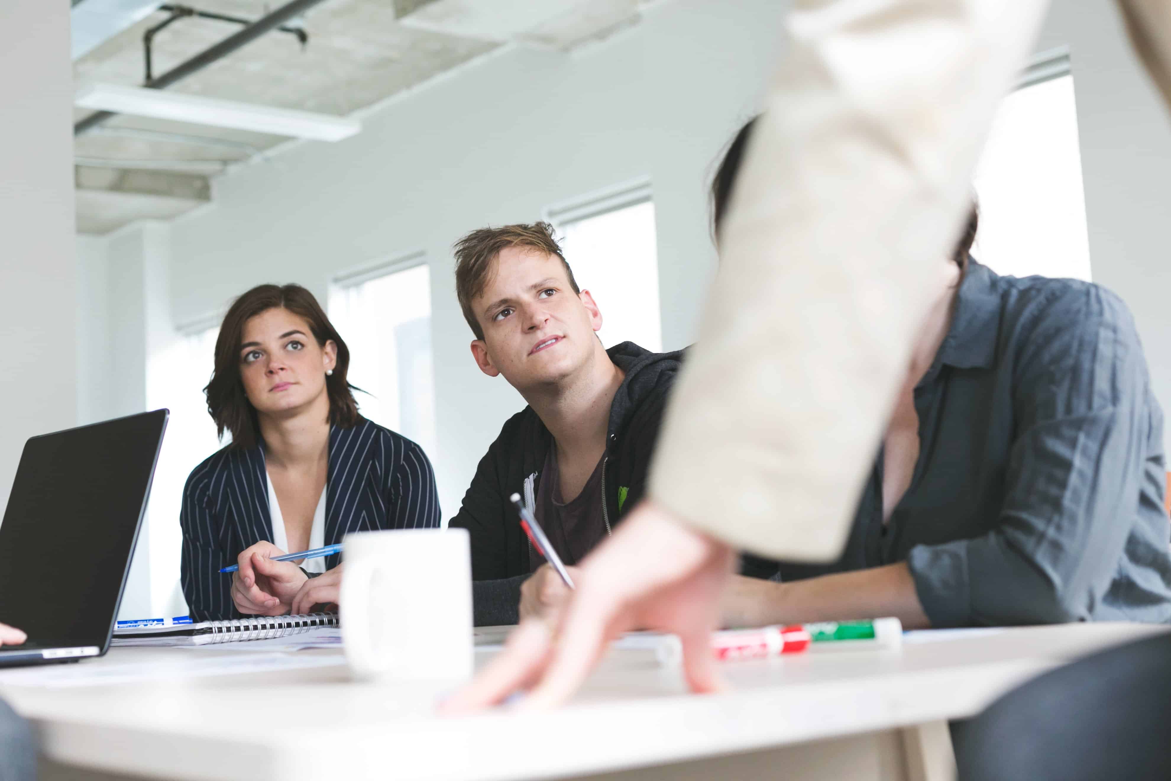 team listening at a meeting