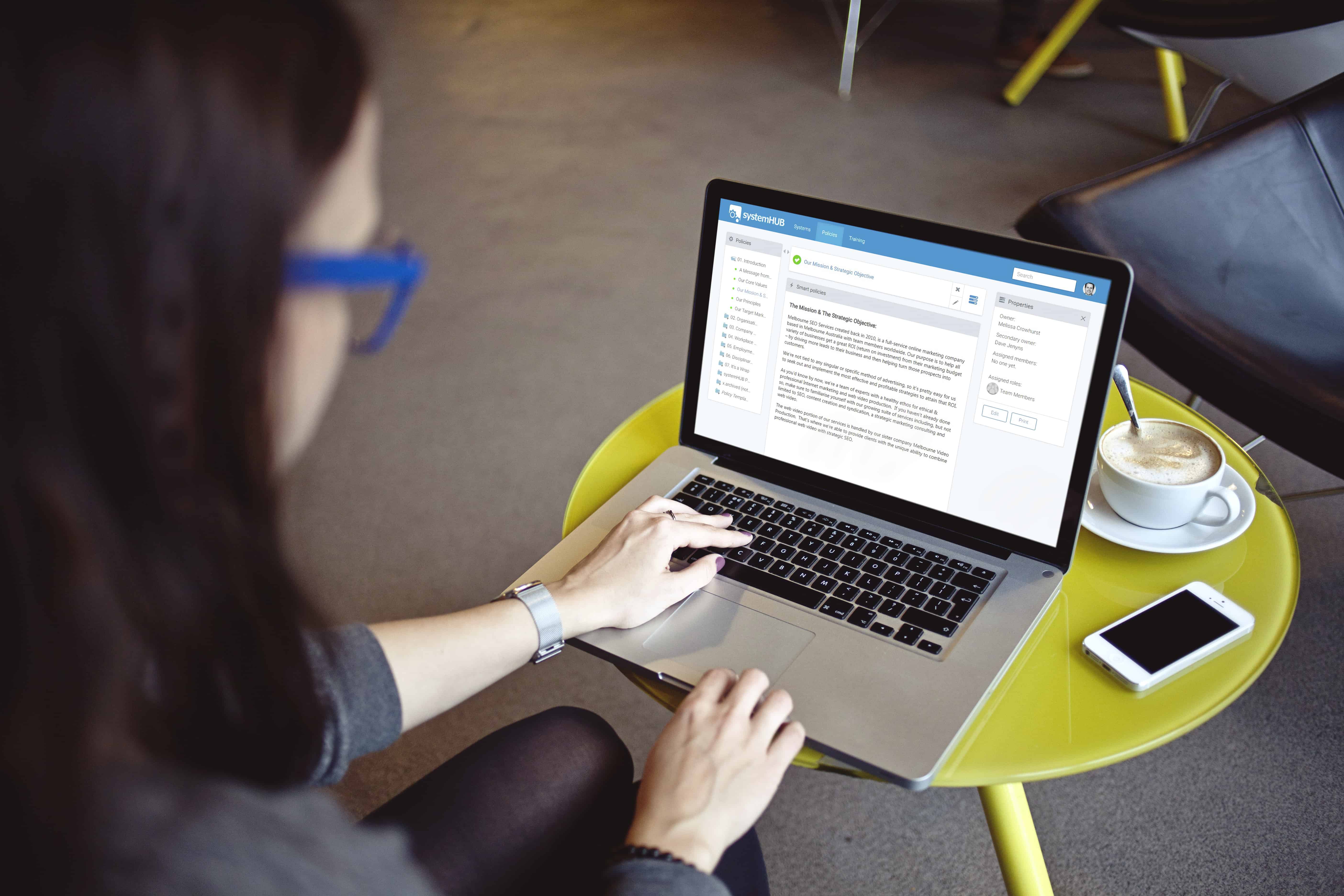 woman checking out systemHUB in a Macbook