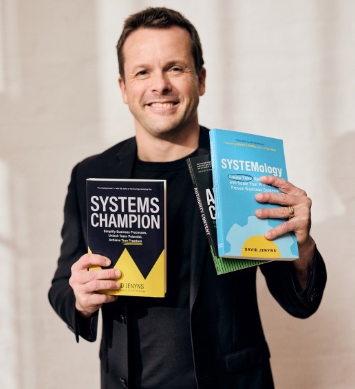David Jenyns holding the SYSTEMology books